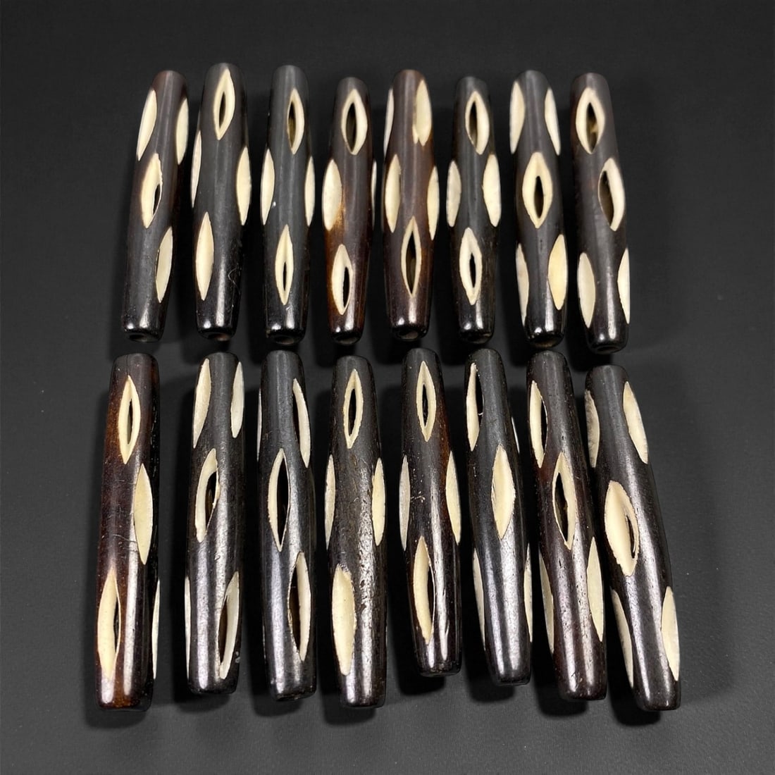 Mid-20th Century Tibetan Hand-Carved Wood Beads, 3.8-3.9cm, 68EP: A collection of Tibetan wood beads, each individually carved and polished, showcasing the natural beauty of the dark-stained grain with contrasting pale surface decoration. These mid-century examples
