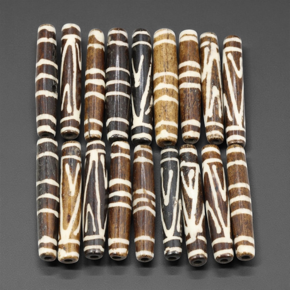 Mid-20th Century Tibetan Hand-Carved Wood Beads, 3.8-4.1cm, 54EJ: A collection of Tibetan wood beads, each individually carved and polished, showcasing the natural beauty of the dark-stained grain with contrasting pale surface decoration. These mid-century examples 