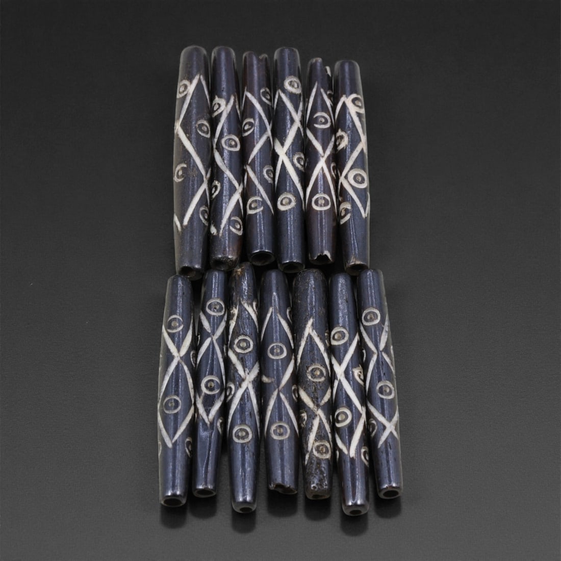 Mid-20th Century Tibetan Hand-Carved Wood Beads, 4.8-5.2cm, 18EJ: A collection of Tibetan wood beads, each individually carved and polished, showcasing the natural beauty of the dark-stained grain with contrasting pale surface decoration. These mid-century examples
