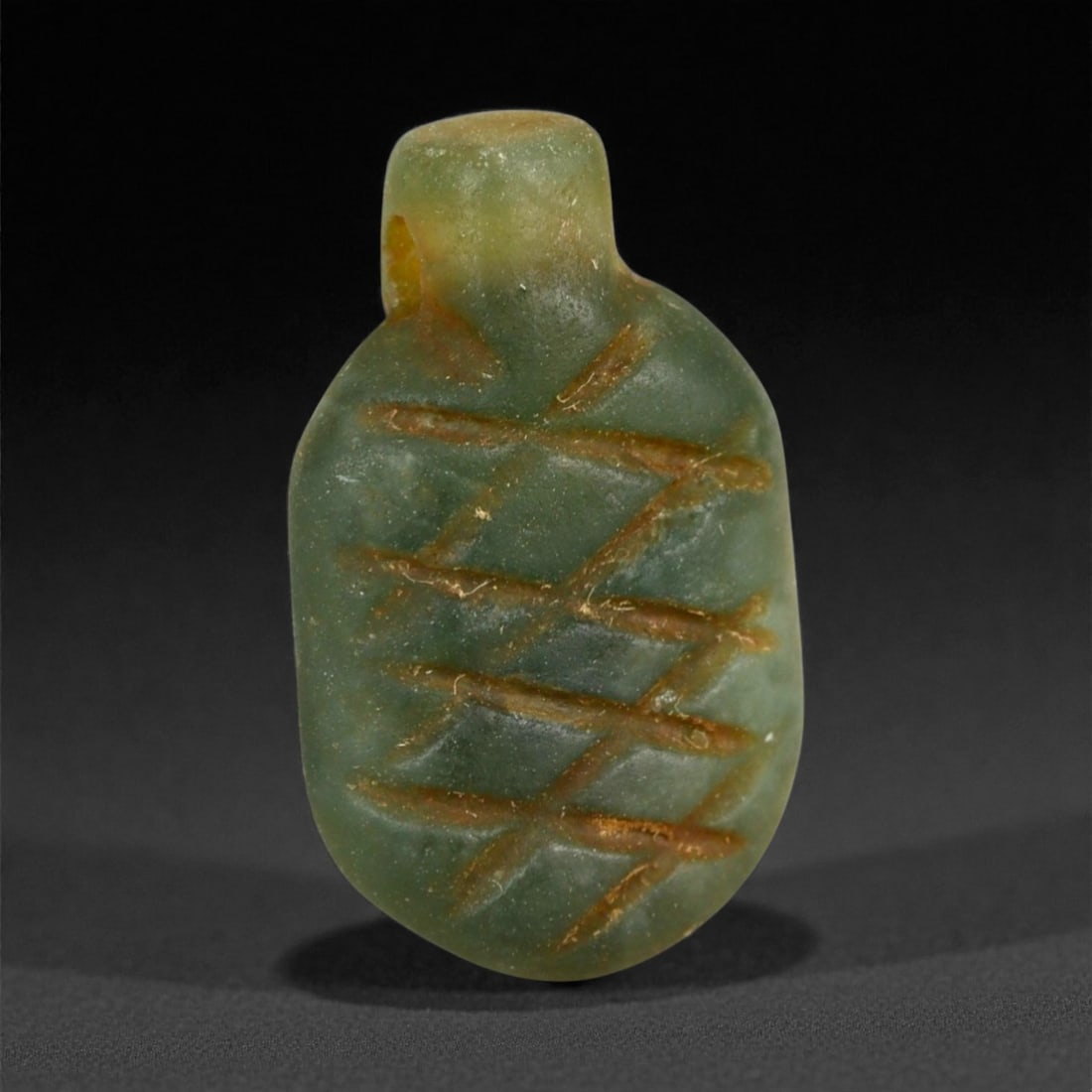 Ancient Egyptian Serpentine Amulet, Middle Kingdom, c. 2050-1650 BCE, 2cm, 91LG: This small yet powerful serpentine amulet, dating to Egypt's Middle Kingdom period (c. 2050-1650 BCE), exemplifies the quiet sophistication of early Egyptian lapidary craftsmanship. Carved from deep g
