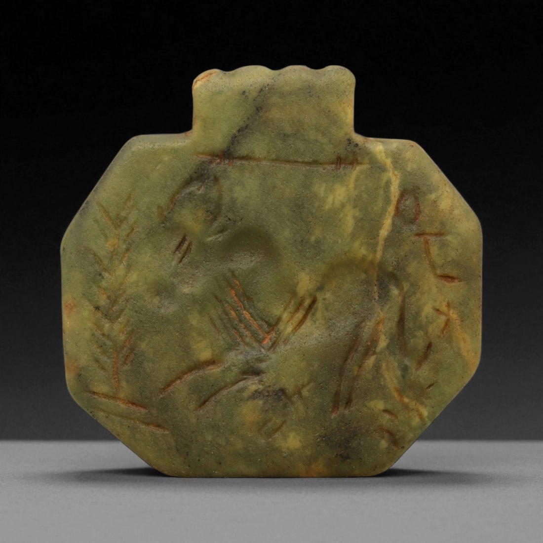 Ancient Neo-Assyrian Greenstone Horse Amulet Pendant, c. 9th-7th Century BCE, 4.5cm, 79DQ: This finely carved greenstone amulet dates to the Neo-Assyrian Empire, one of the most powerful and artistically advanced civilizations of the ancient Near East. Flourishing between the 9th and 7th ce