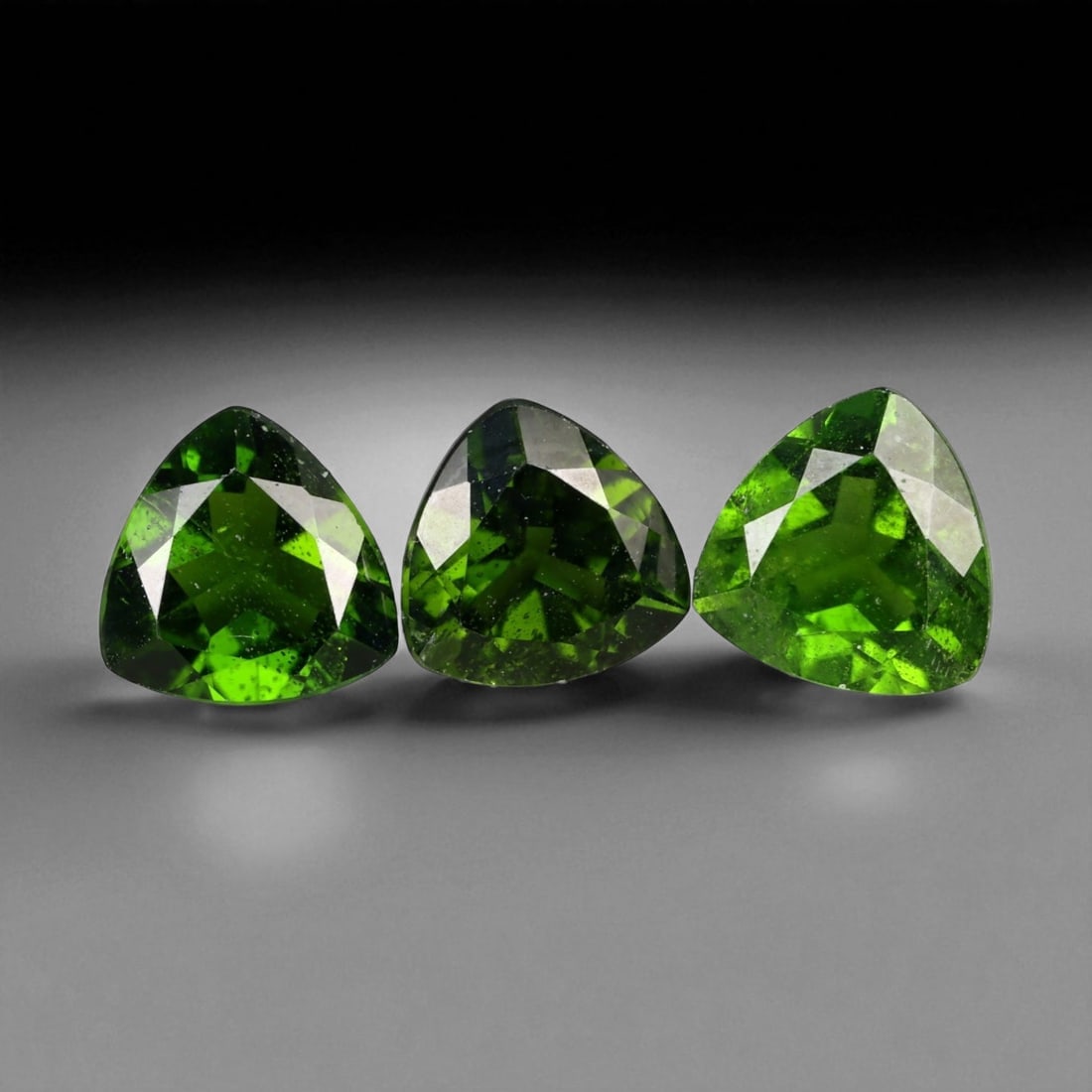 3.40 Carats Vivid Green Faceted Chrome Diopside Parcel - Natural Russian Stones, 51XB: This dazzling parcel of chrome diopside gems glows with an intense forest-green hue, alive with clarity and brilliance. Each faceted stone, averaging 7.1x3.8 mm, reflects light with crisp precision, r