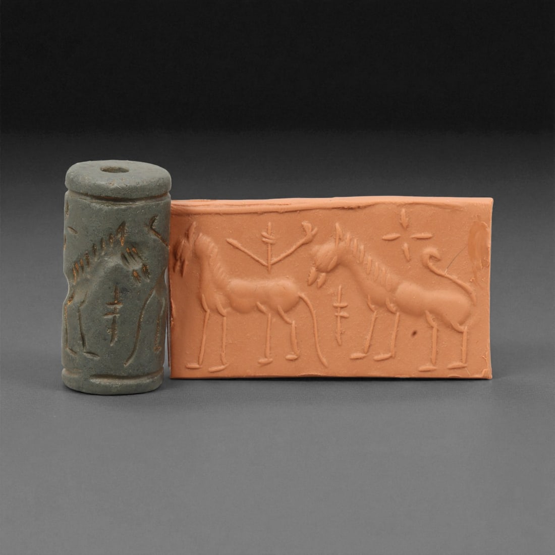 Ancient Near Eastern Stone Cylinder Seal of Mythic Motifs, c. 2nd-1st Millennium BCE, 3.9cm, 15M: A striking relic from the dawn of civilization, this ancient Mesopotamian cylinder seal dates to the 2nd-1st millennium BCE - a period when art, writing, and ritual became inseparable expressions of c