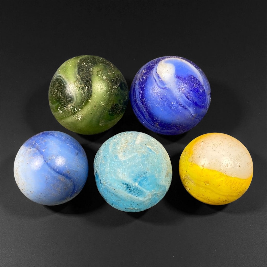 Vintage Glass Marbles Lot, Mid-20th Century, 1.5-1.8cm, 47EK: This charming lot of vintage glass marbles, dating from the mid-20th century, reflects the artistry and playfulness of early handmade and molded glass craftsmanship. These marbles were produced during