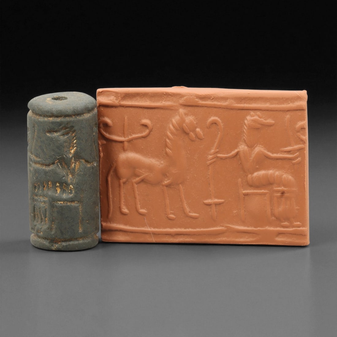 Ancient Mesopotamian Akkadian Steatite Cylinder Seal, c. 2300-2100 BCE, 3.8cm, 12EV: Carved from fine dark steatite, this ancient Akkadian cylinder seal dates to the late 3rd millennium BCE, a period when Mesopotamian artisans perfected the art of miniature relief engraving. Each seal