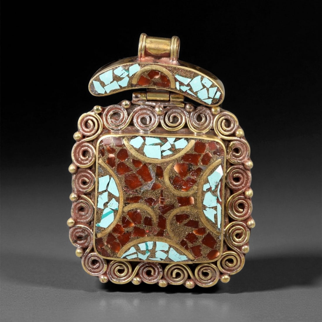 Vintage Himalayan Gilt Copper Turquoise Coral Mosaic Amulet Pendant, 20th Century, 6.5cm, 41EQ: This bold Himalayan amulet pendant, crafted in the 20th century, showcases intricate mosaic artistry in turquoise and coral set against a gilt copper frame. The square form is framed by coiled spiral 