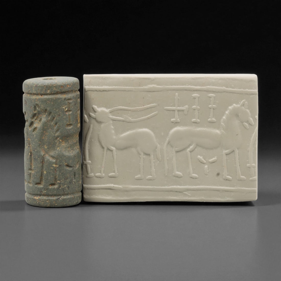 Ancient Mesopotamian Akkadian Steatite Cylinder Seal, c. 2300-2100 BCE, 4.1cm, 87EL: Carved from fine dark steatite, this ancient Akkadian cylinder seal dates to the late 3rd millennium BCE, a period when Mesopotamian artisans perfected the art of miniature relief engraving. Each seal