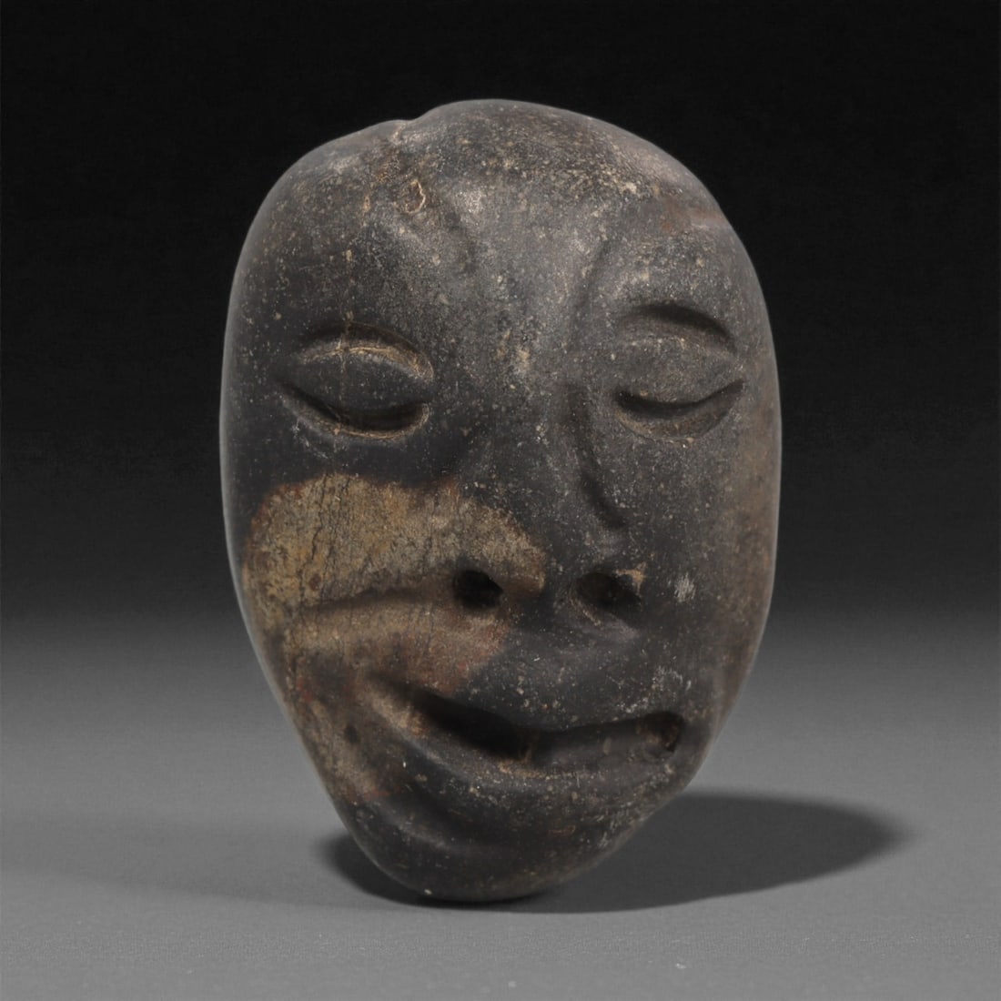 A Mediterranean Stone Maskette, 12th-17th Century, 57LC (1 of 2)