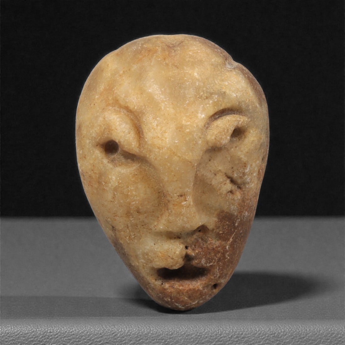 A Mediterranean Stone Maskette, 12th-17th Century, 22AC (1 of 2)