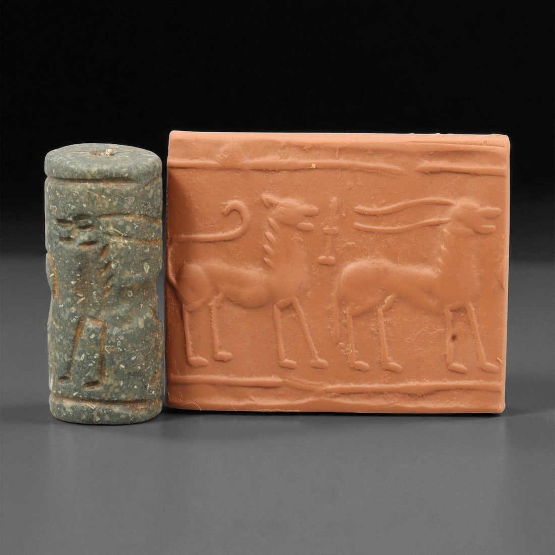 A Mesopotamian Stone Cylinder Seal, 3rd-2nd Millennium BCE, 4cm, 84EJ: This Mesopotamian cylinder seal dates to the 2nd-1st millennium BCE. Carved from stone, it would have been used to roll designs onto wet clay as a mark of ownership or identification. The seal fits co