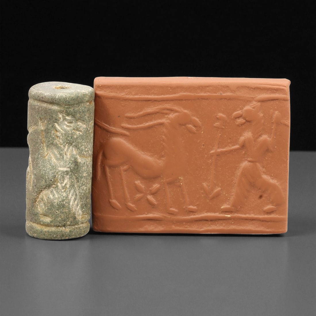 A Mesopotamian Stone Cylinder Seal, 3rd-2nd Millennium BCE, 4.1cm, 67EJ: This Mesopotamian cylinder seal dates to the 2nd-1st millennium BCE. Carved from stone, it would have been used to roll designs onto wet clay as a mark of ownership or identification. The seal fits co