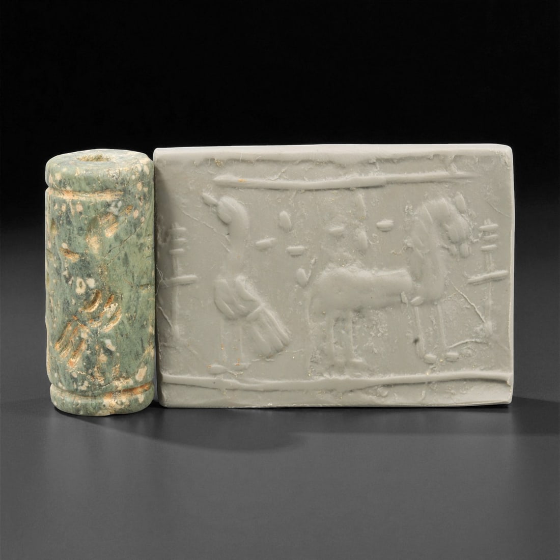 A Mesopotamian Stone Cylinder Seal, 3rd-2nd Millennium BCE, 3.7cm, 96EJ: This Mesopotamian cylinder seal dates to the 2nd-1st millennium BCE. Carved from stone, it would have been used to roll designs onto wet clay as a mark of ownership or identification. The seal fits co