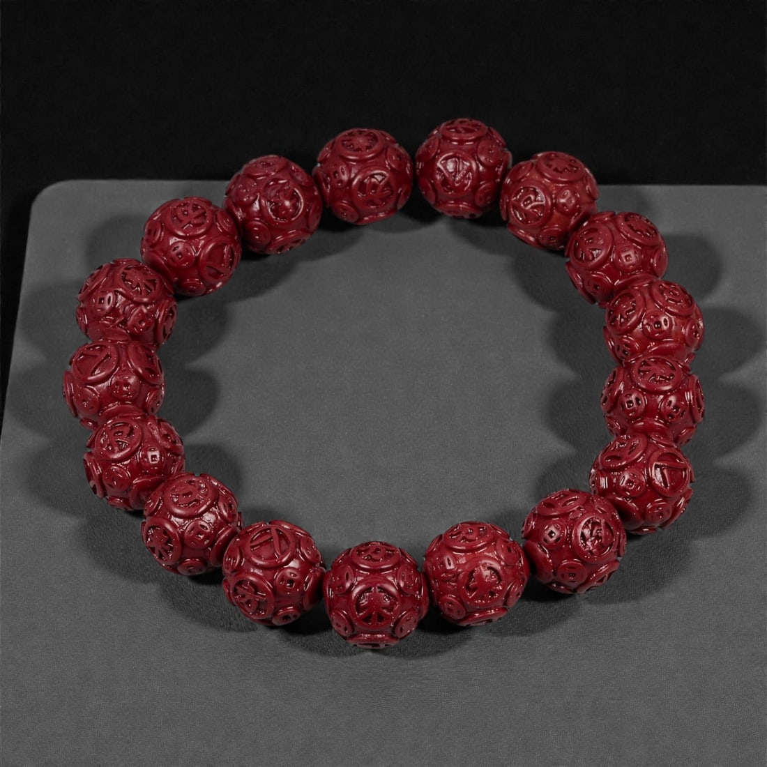 A Chinese Cinnabar Carved Bead Bracelet, 20th Century, 53FD (1 of 1)
