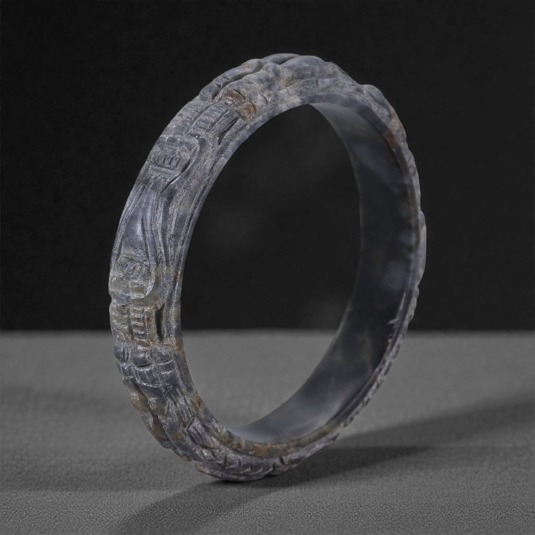 Jadeite Jade Dragon Bracelet - Carved Asian Bangle, 6.2cm Inner Diameter, 31WE: Carved from dense grey-green jadeite, this bracelet is formed as a continuous circular bangle with sculptural relief carving along the exterior surface. The stone has been hollowed and shaped through