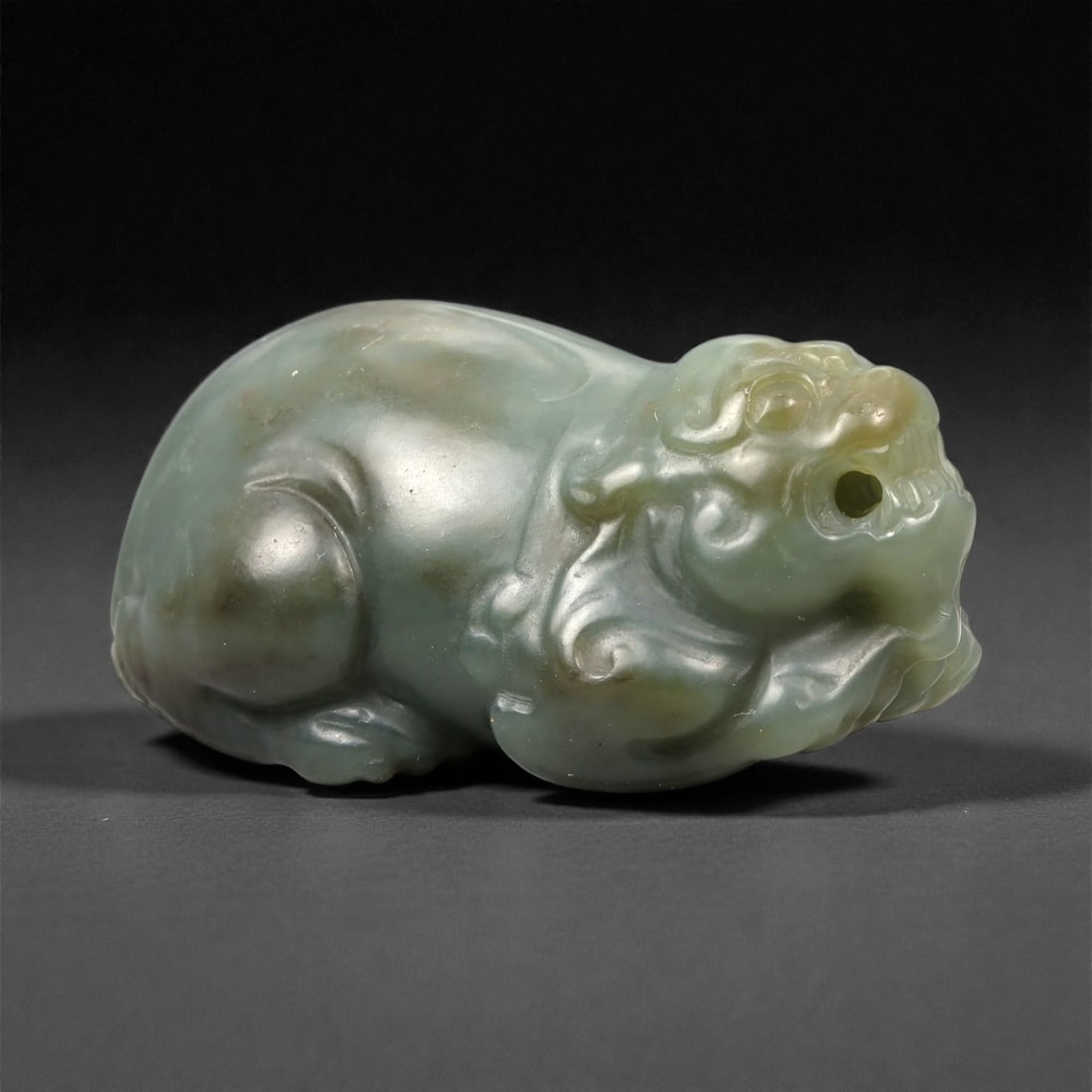 Chinese Jade Pixiu Beast - Carved Animal Figurine 5.2cm, 90ZC, 90ZC: Carved from pale green jade with soft translucency and subtle tonal variation, this sculptural figure represents a pixiu shown in a compact recumbent posture. The carving is executed fully in the roun