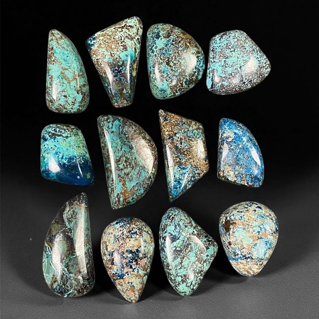 Blue-Green Azurite Parcel - Natural Mixed Shape Selection, 1.6-2.5 cm, 31XE: A striking blend of turquoise-green and deep azure hues, this captivating azurite parcel showcases a vibrant interplay of earthy patterns and electric color zoning. The stones gleam with polished surf