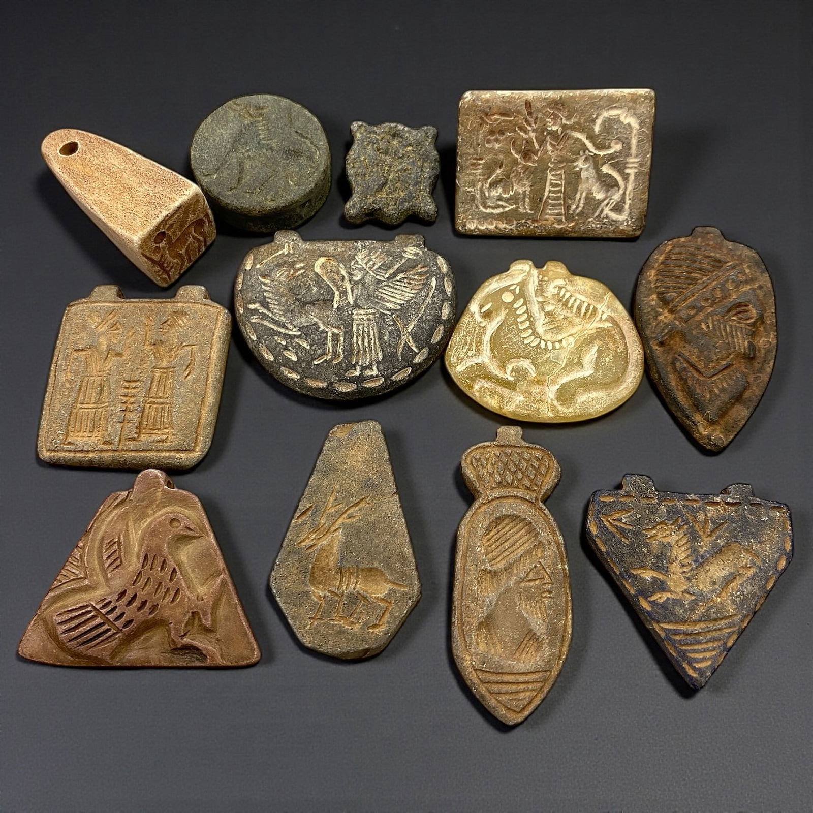 A Group of Twelve Near Eastern Stone Amulets and Stamp Seals, First Millennium BCE, 59V (1 of 2)
