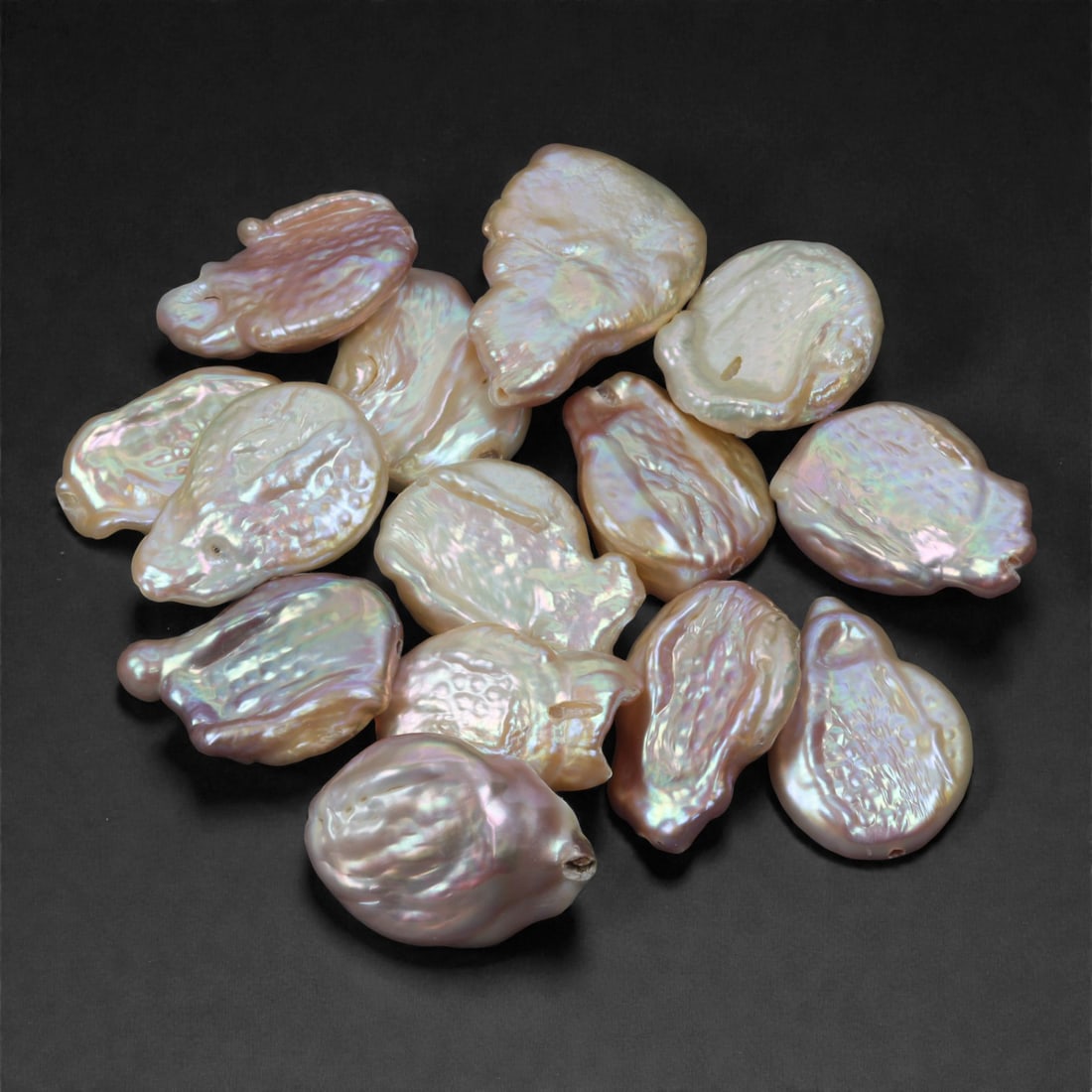 165.02 Carats Iridescent Pink-White Baroque Pearl Parcel - Natural Freshwater Origin, 32XJ: This beautifully curated parcel of baroque pearls offers a glowing pastel palette with soft pink, blush white, and delicate lavender overtones. Each pearl reflects light with a mirror-like sheen, reve