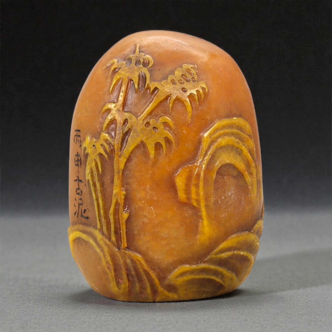 A Chinese Shoushan Stone Stamp Seal, Late Qing Dynasty-Early 20th Century, 12FA: Carved from warm-toned Shoushan stone with natural mottling and subtle translucency, the stamp seal is of rounded rectangular form, the sides worked in low relief with a continuous landscape compositi