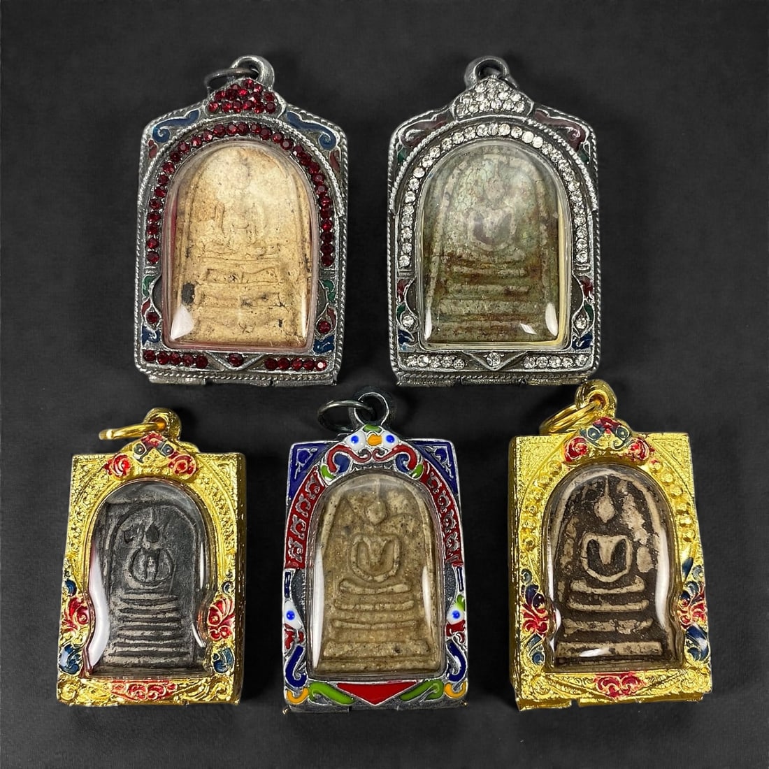 A Group of Five Thai Buddhist Amulets, 20th Century, 18XJ (1 of 2)