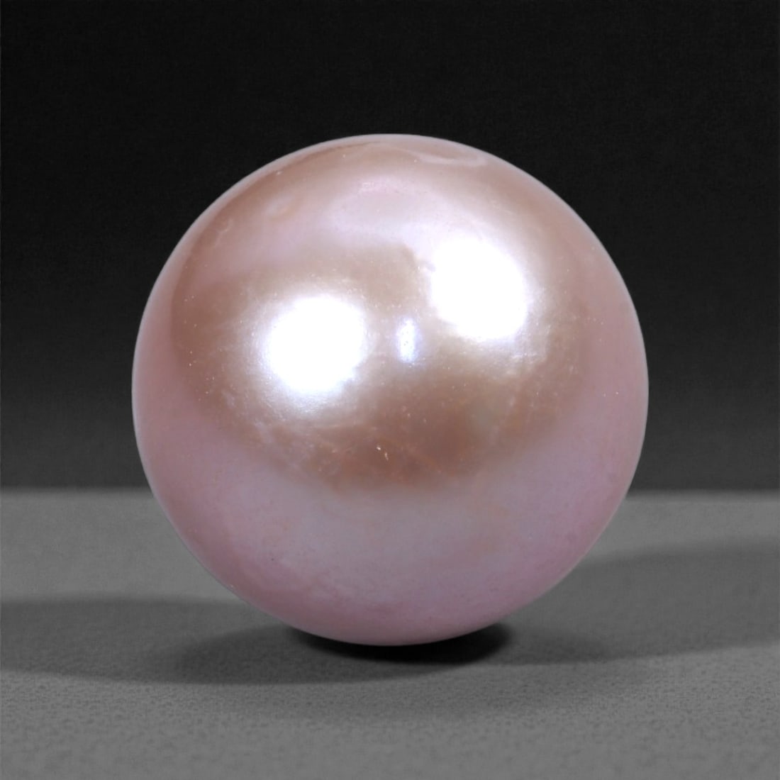 15.79 Carats Blush Lavender Statement Pearl - Natural Freshwater Gem, 13mm, 74XH: This substantial natural pearl commands attention with its luminous blush lavender tone and softly mirrored surface. At 13mm, it showcases a bold presence balanced by gentle overtones of rose, cream,