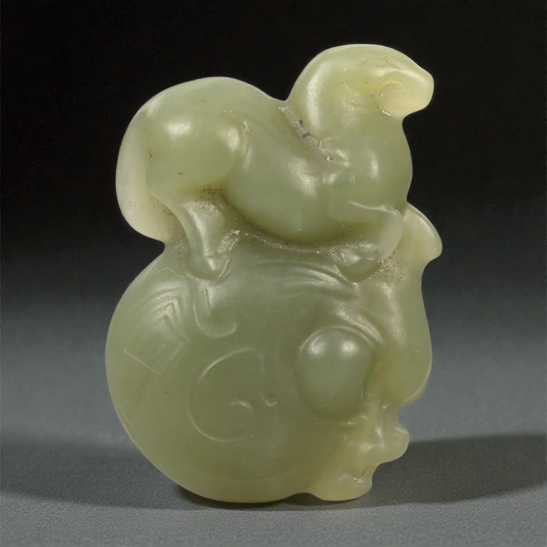 A Chinese Nephrite Jade Horse atop Circular Form, 20th Century, 40FA (1 of 2)