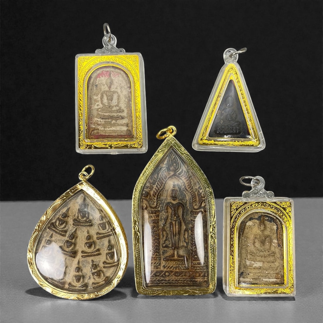 A Group of Five Thai Buddhist Amulets, 20th Century, 9XJ (1 of 2)