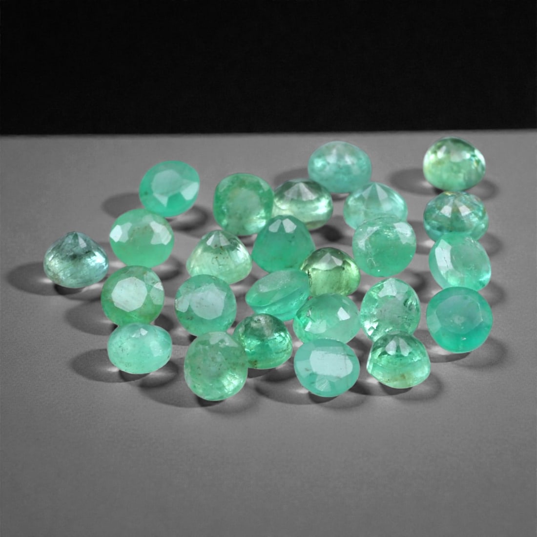 3.00 Carats Bright Green Emerald Parcel - Natural Zambian Stones, 3x1.9mm, 91XH: This vibrant parcel of Zambian emeralds features petite, faceted rounds in a crisp, medium-bright green hue with natural translucency and light internal character. The stones offer a glowing botanical