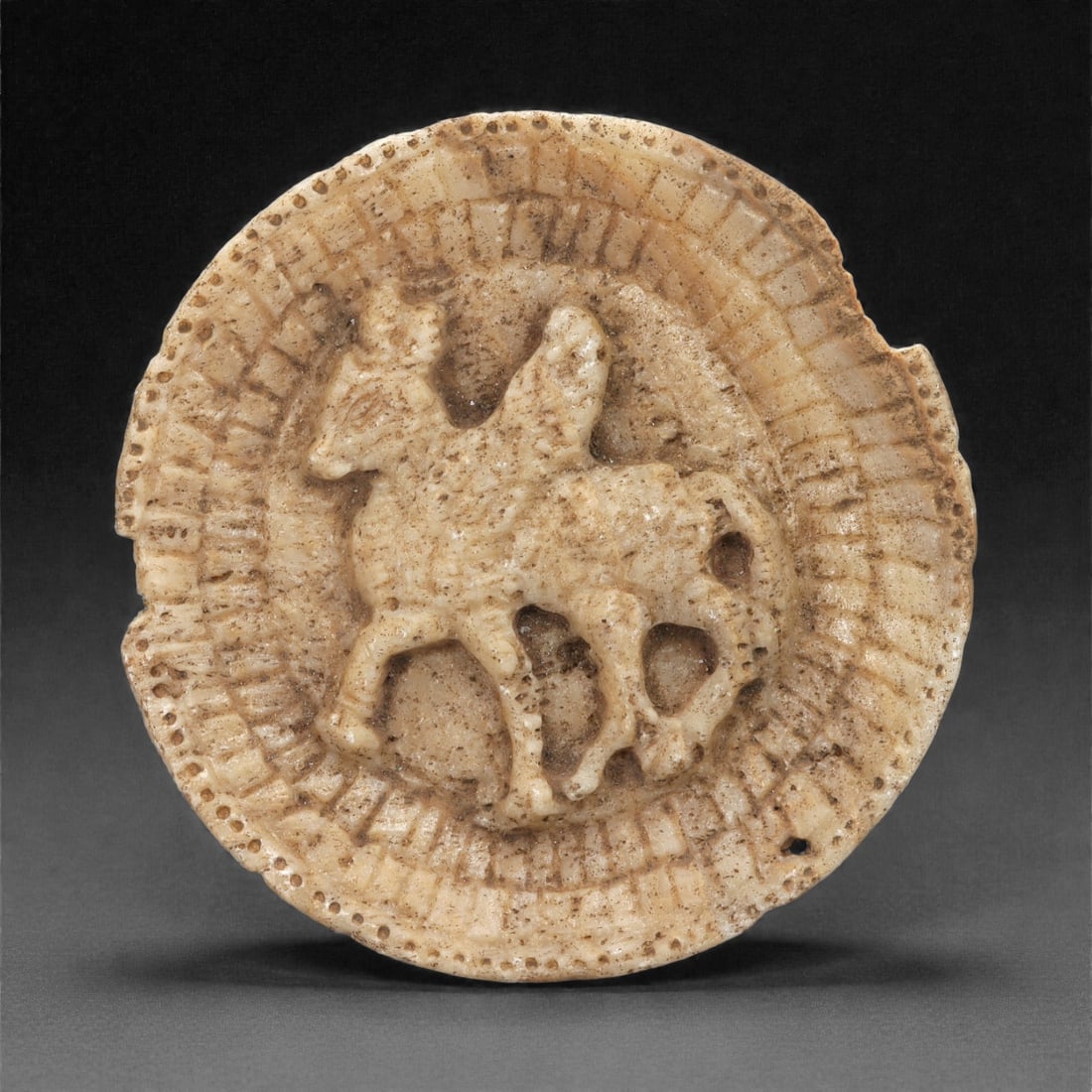 A Near Eastern Calcite Relief Plaque with Winged Quadruped, 1st Millennium CE, 14LN (1 of 2)