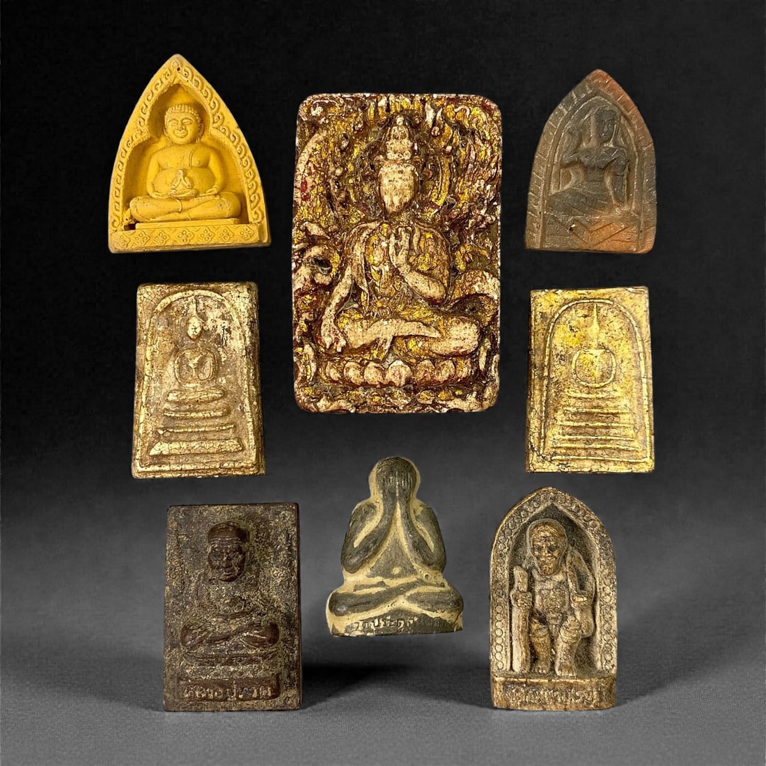 A Group of Eight Thai Clay and Terracotta Amulets, 20th Century, 13XJ (1 of 2)