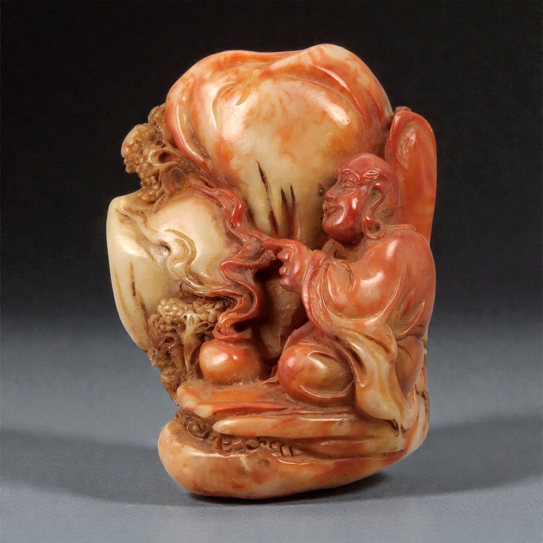 A Chinese Shoushan Stone Seal Carved with a Figure and Landscape Motifs, 20th Century, 19FD (1 of 3)