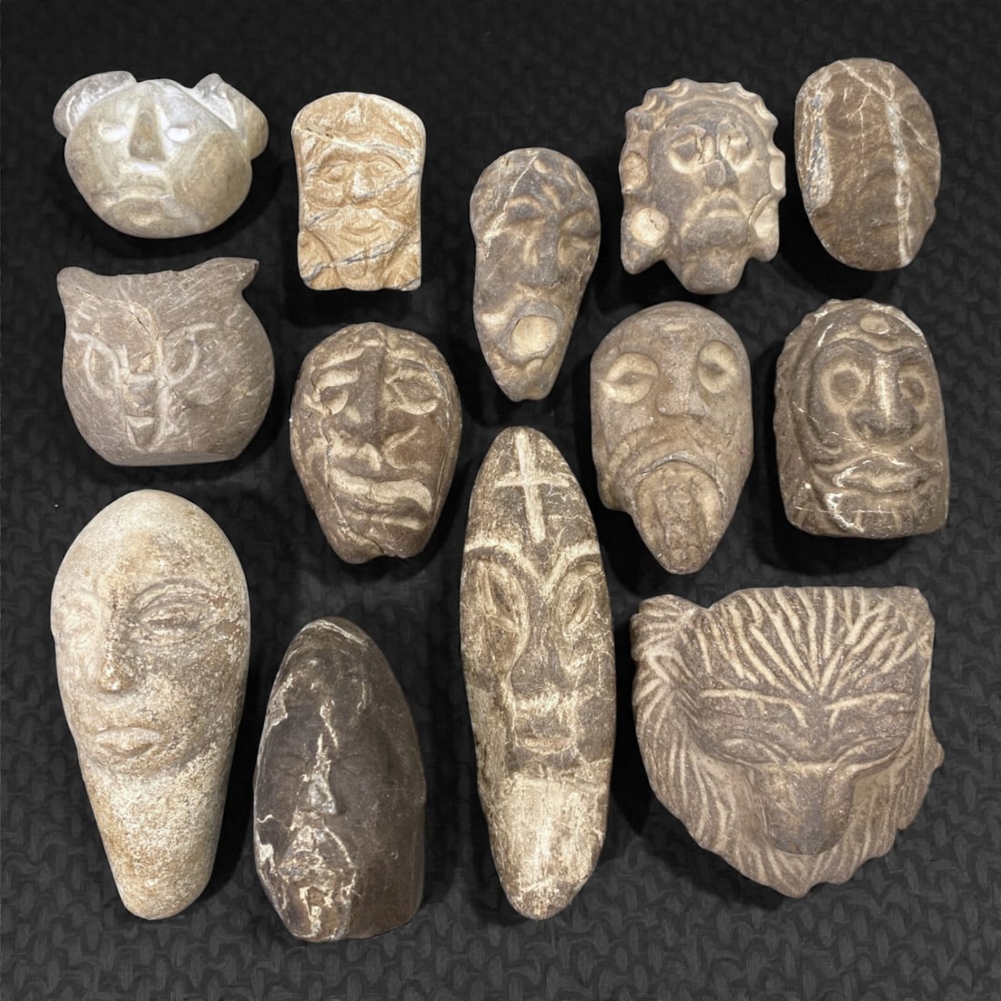 A Group of Ancient Stone Maskettes, 82Z (1 of 1)