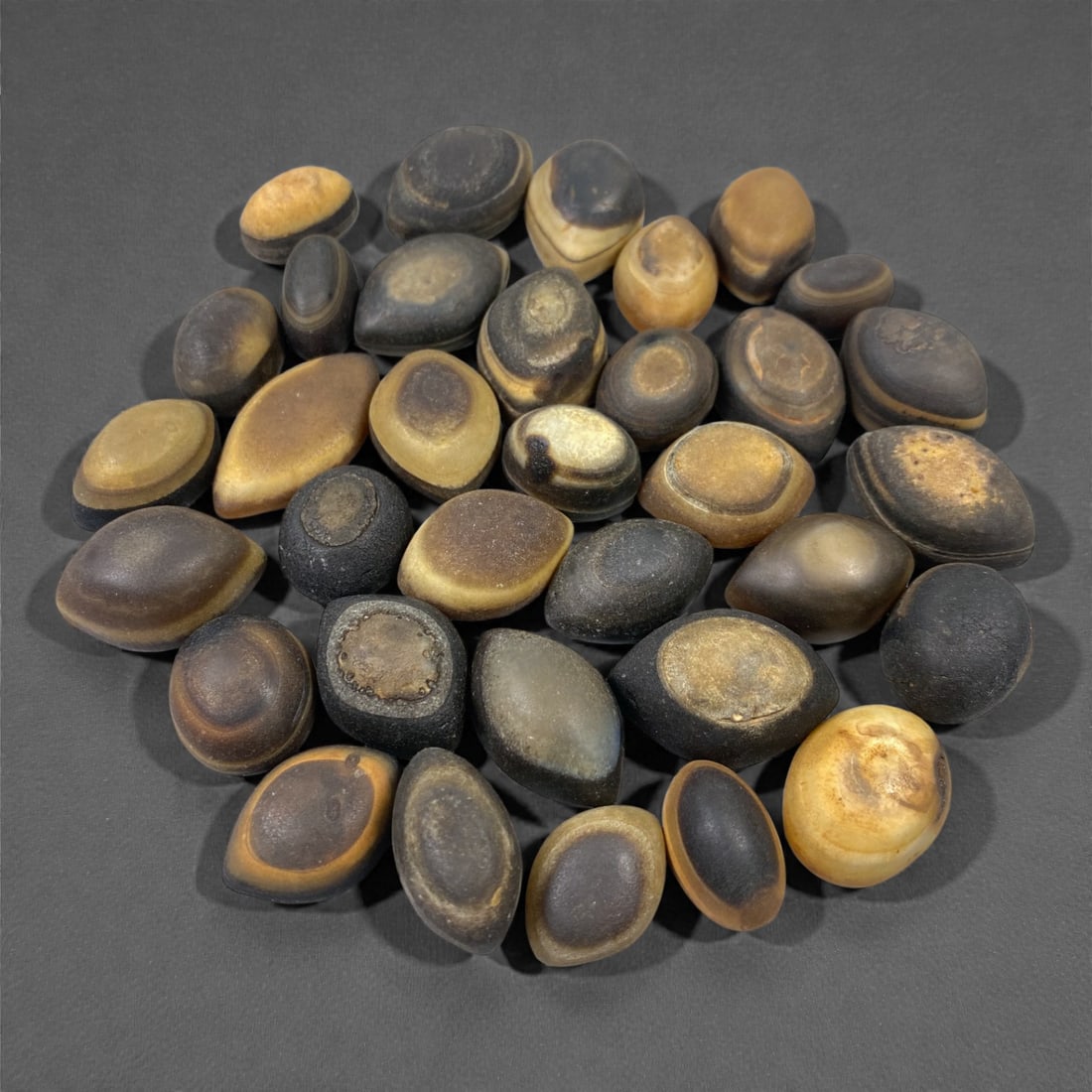 A Group of Tibetan Luk Mik ("Goat's Eye") Agate Beads, 11th-14th Century CE, 90V (1 of 1)