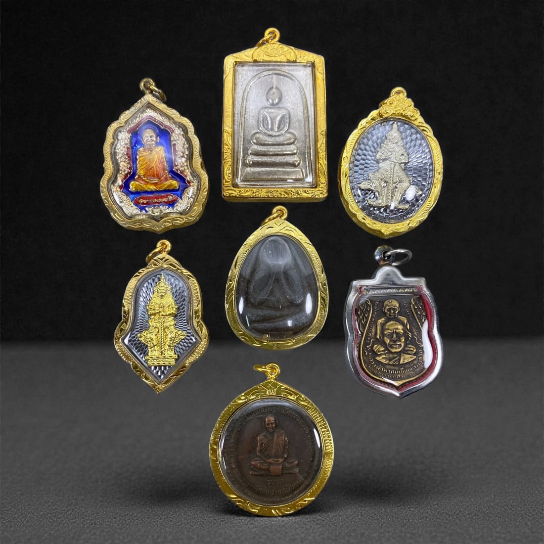 A Group of Seven Thai Amulets, 20th Century, 80V (1 of 1)