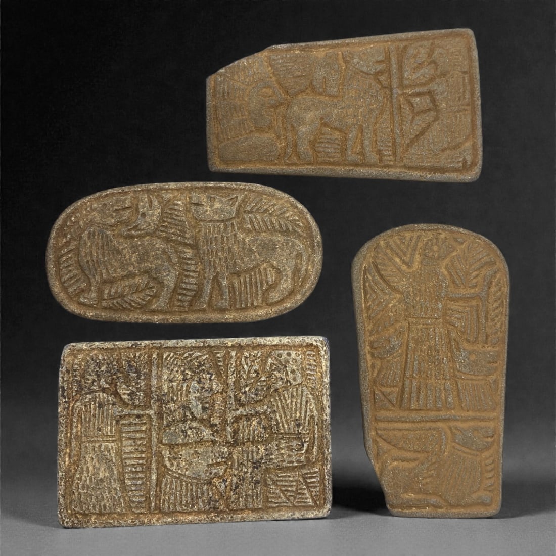 A Sasanian Lapis Lazuli Relief Plaque Group, 3rd-7th Century CE, 73V: Comprising four relief plaques carved from lapis lazuli, each example is worked in low relief with figural and decorative motifs associated with Sasanian visual traditions. The plaques vary in format,