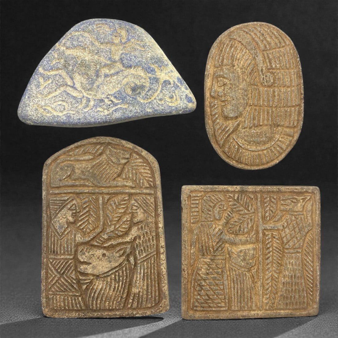 A Sasanian Lapis Lazuli Relief Plaque Group, 3rd-7th Century CE, 83V: Comprising four relief plaques carved from lapis lazuli, the group displays figural and decorative motifs associated with Sasanian visual traditions, rendered in low relief with an emphasis on surface