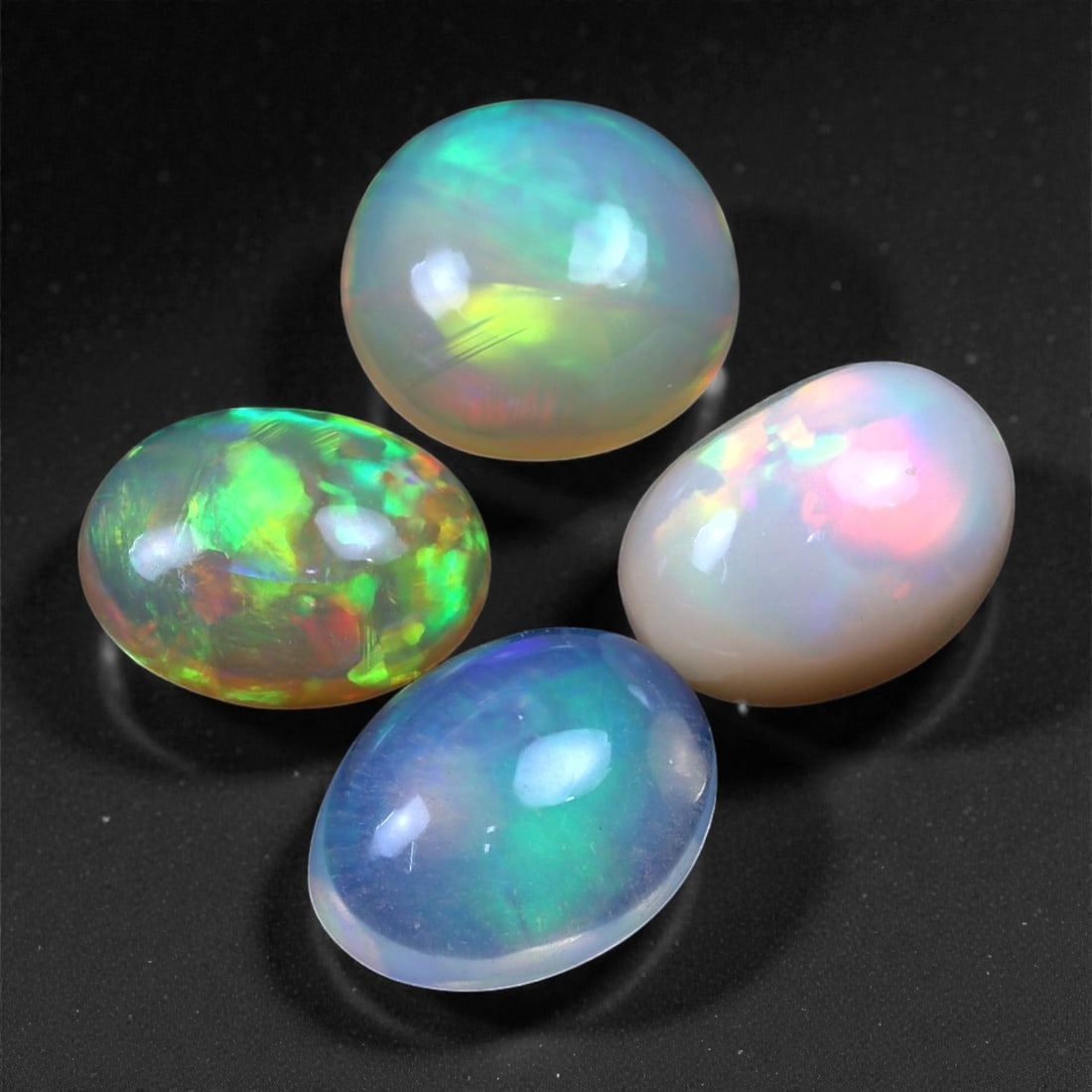 5.60 Carats Neon Play-of-Color Opal Selection - Natural Ethiopian Cabochons - 8 to 9 mm, 36XC (1 of 1)