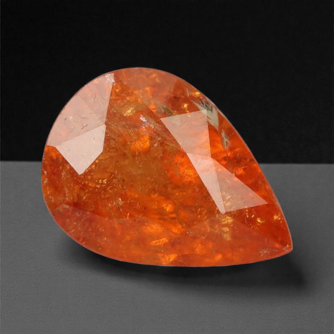 2.71 Carats Vivid Orange Mandarin Garnet - Natural Namibian - 9.9 x 7.1 x 5.1 mm, 36XK: Bursting with intense orange fire, this pear-shaped mandarin garnet commands attention with its saturated tangerine hue and lively internal glow. The gem's brilliant transparency and refractive sparkl