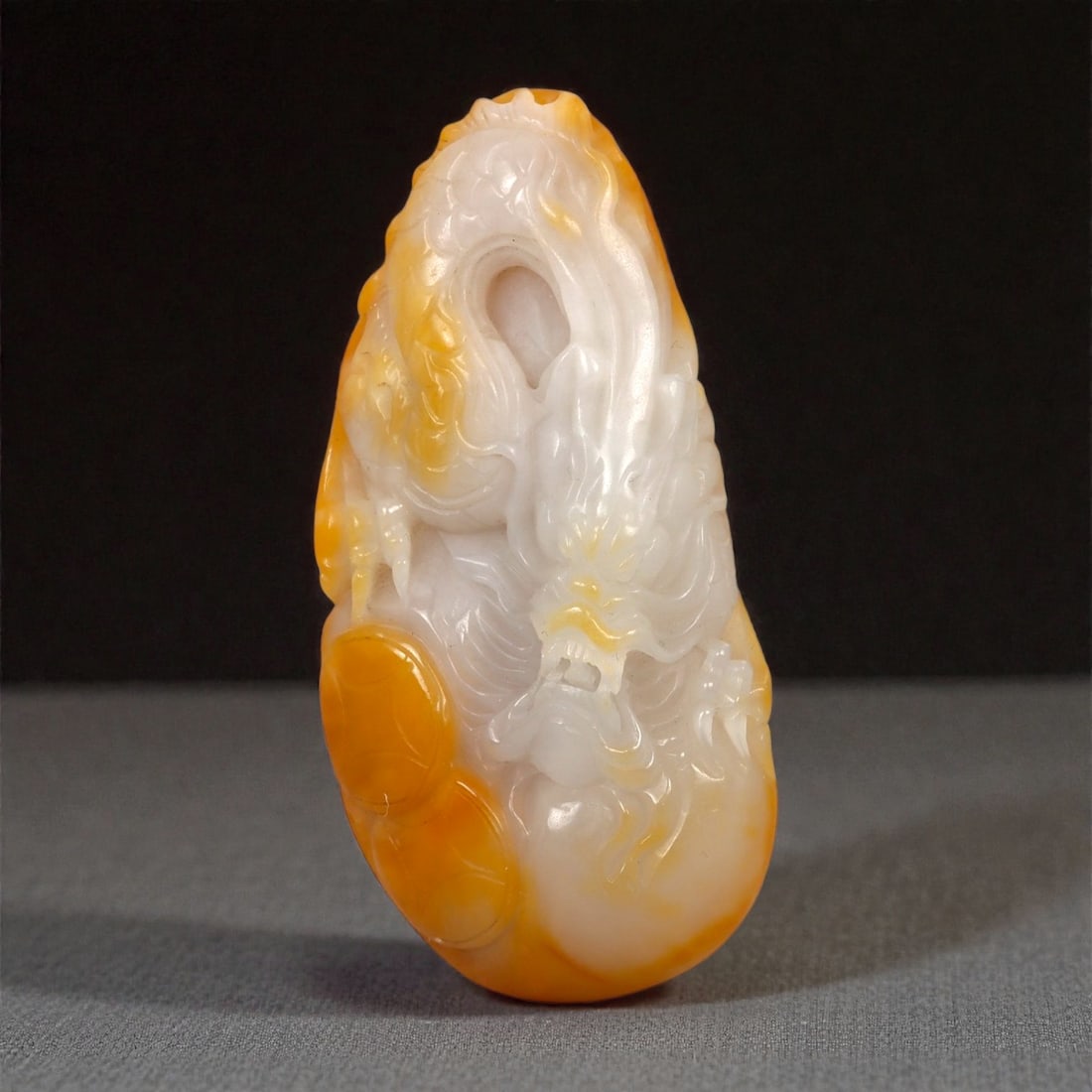 A Chinese Nephrite Jade Dragon-Form Pendant, 20th Century, 57FB (1 of 2)