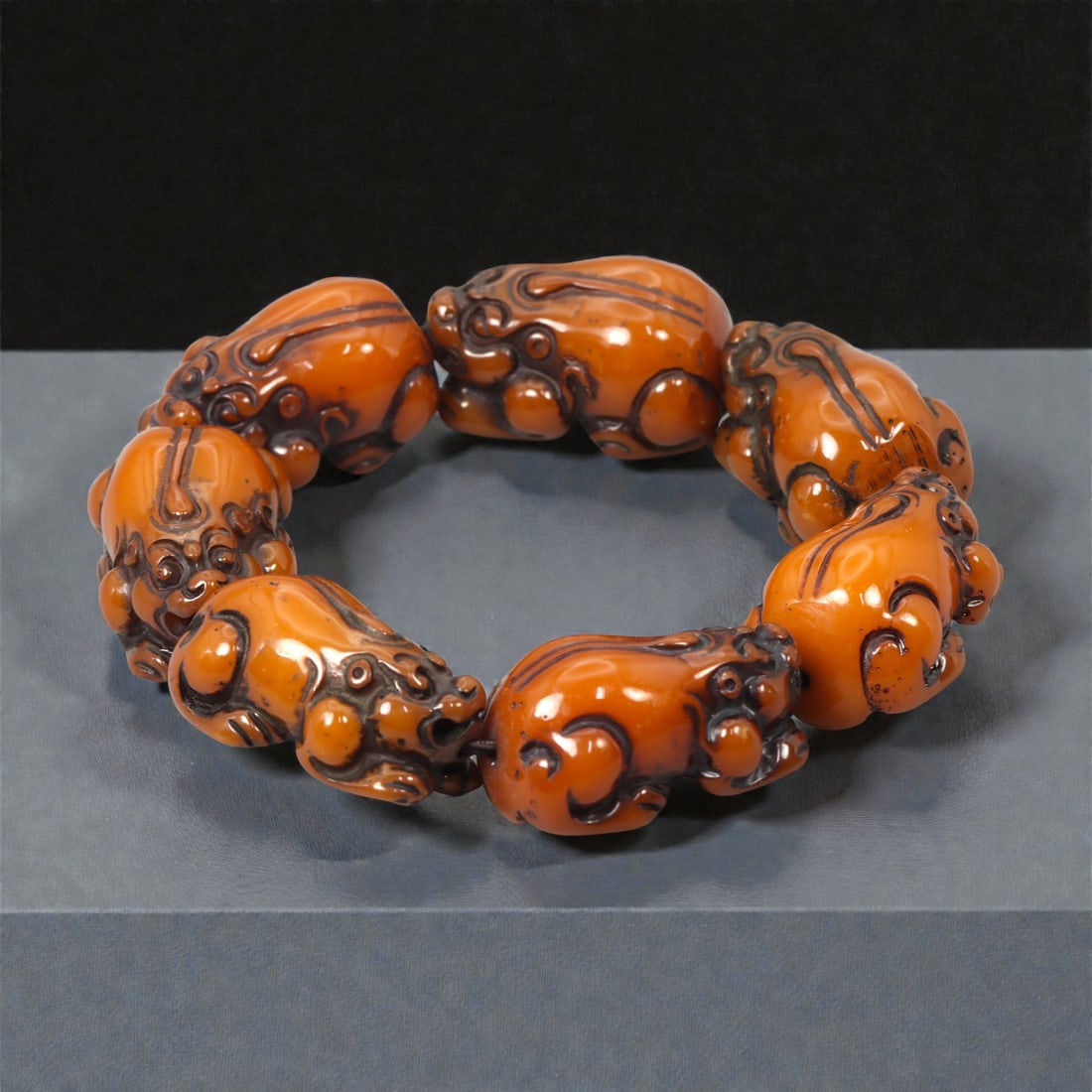 A Chinese Amber-Resin Pixiu Bracelet, 20th-21st Century, 67FC (1 of 2)