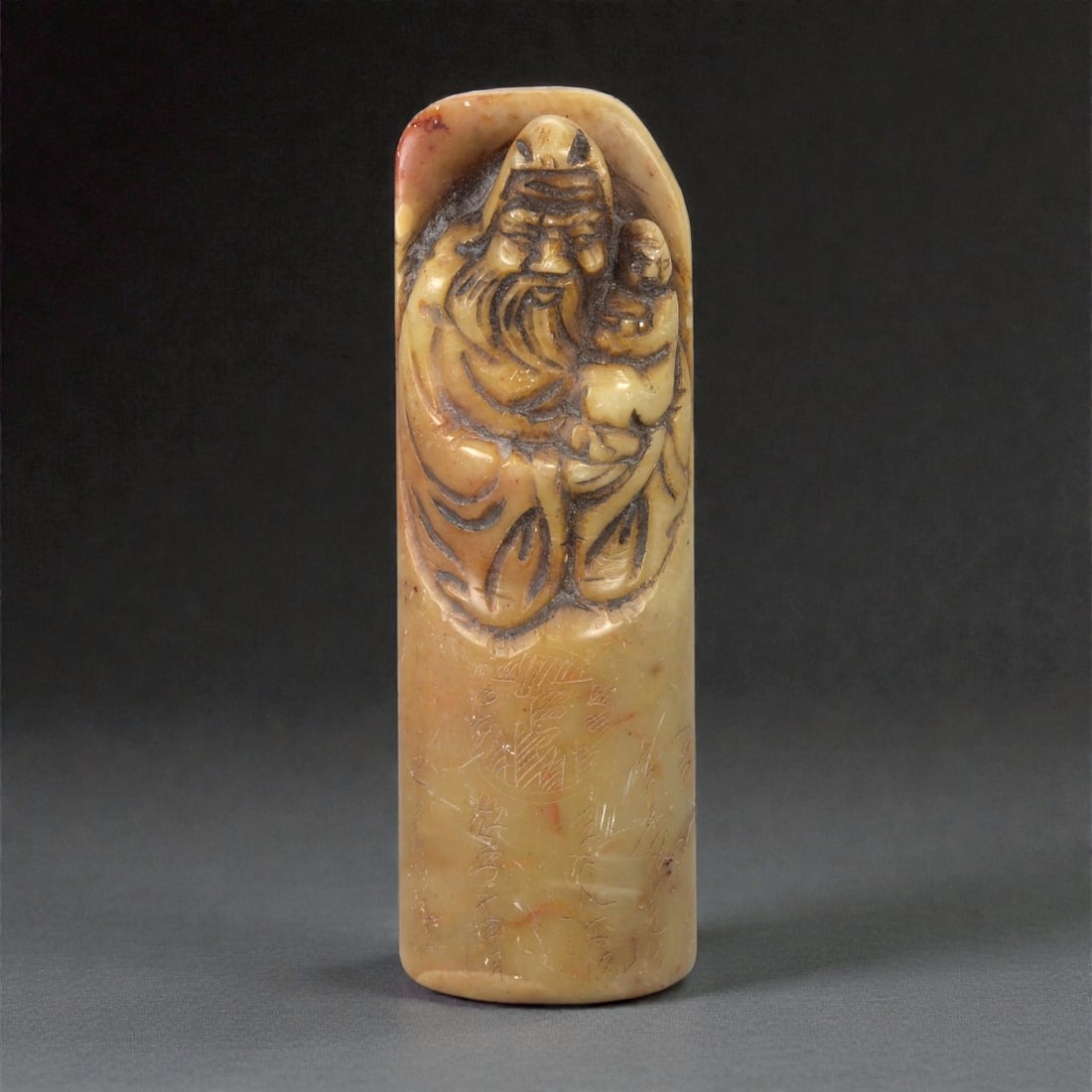 A Chinese Shoushan Stone Stamp Seal, 20th Century, 5FA: Carved from pale beige to light ochre Shoushan stone with areas of natural mottling and subtle tonal variation, the seal is worked in a cylindrical form with a flat circular seal face. The upper termi