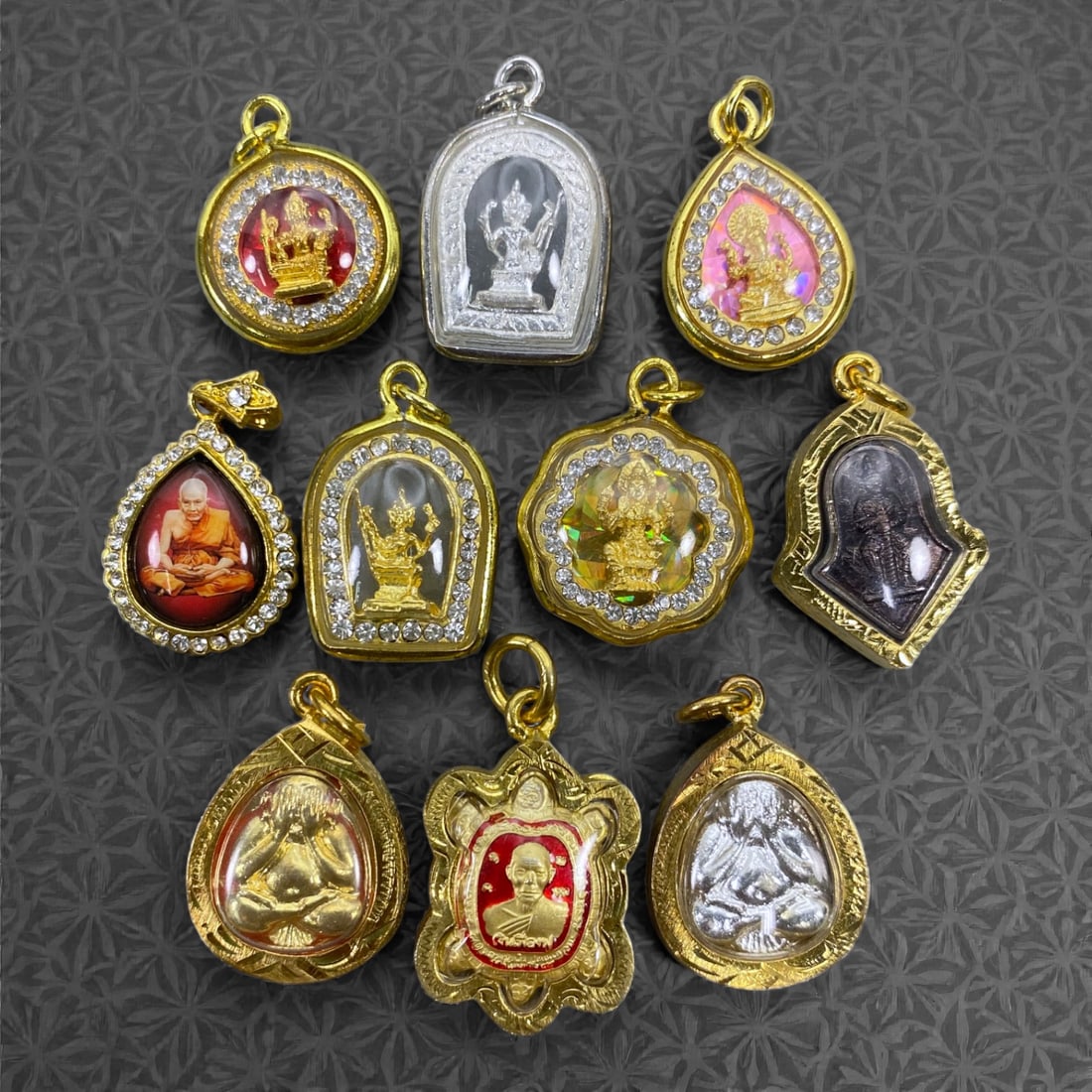 A Group of Ten Thai Buddhist Amulets, 20th Century, 32W (1 of 1)