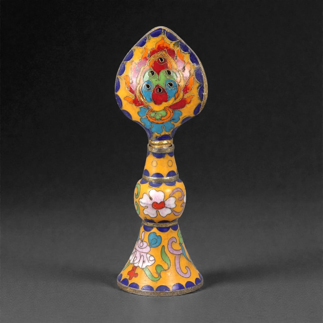 A Tibetan-Style Cloisonne Enamel Offering Object, 20th Century, 4FJ: The object is constructed from a copper body decorated with cloisonne wirework and opaque enamel. It is formed with a flared foot supporting a baluster-shaped shaft rising to a leaf-shaped terminal. T