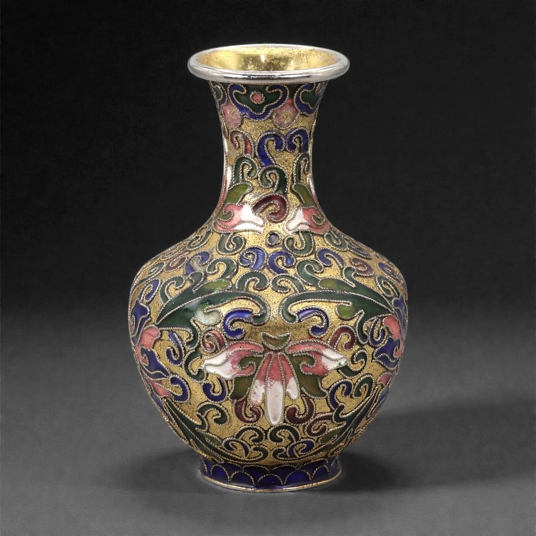 A Chinese Cloisonne Enamel Vase, 20th Century, 3FJ: The vessel is formed from a copper body with dense cloisonne wirework filled with opaque polychrome enamels. It is potted with a globular body rising from a short foot to a waisted neck and flared rim