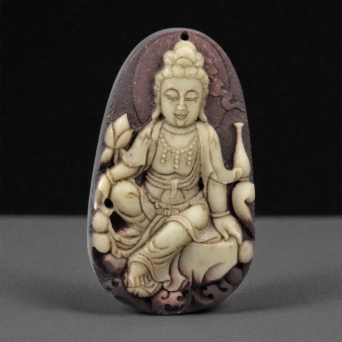 A Chinese Stone Guan Yin Pendant, 20th Century, 74FH (1 of 2)