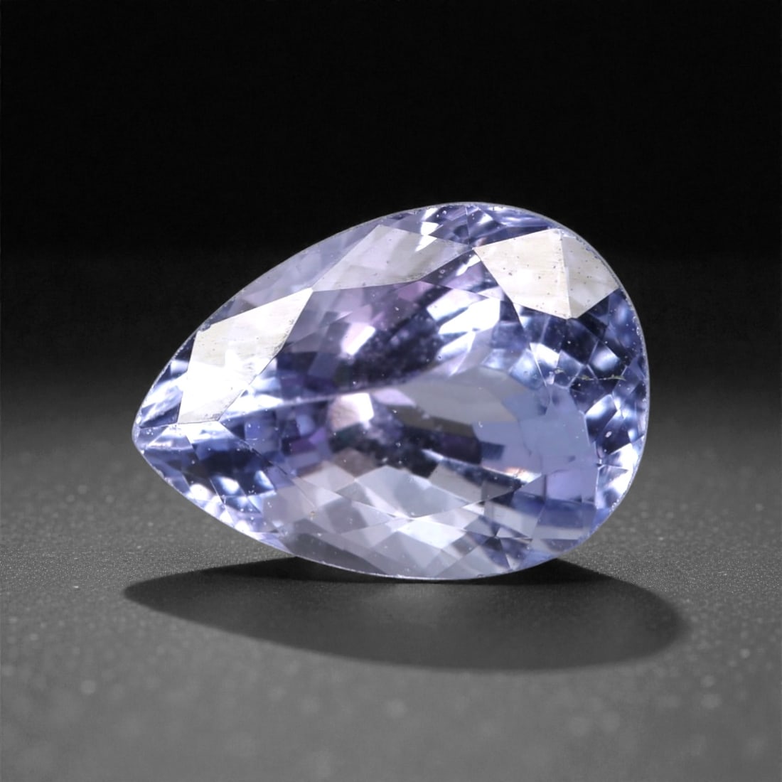 2.11 Carats Violet Blue Tanzanian Tanzanite Pear Cut - 9.1 x 6.5 x 5.2 mm, 60XK: This attractive tanzanite displays a soft yet lively violet blue hue with flashes of lavender and cool blue as light moves across the stone. The pear cut gives it an elegant silhouette, combining roun