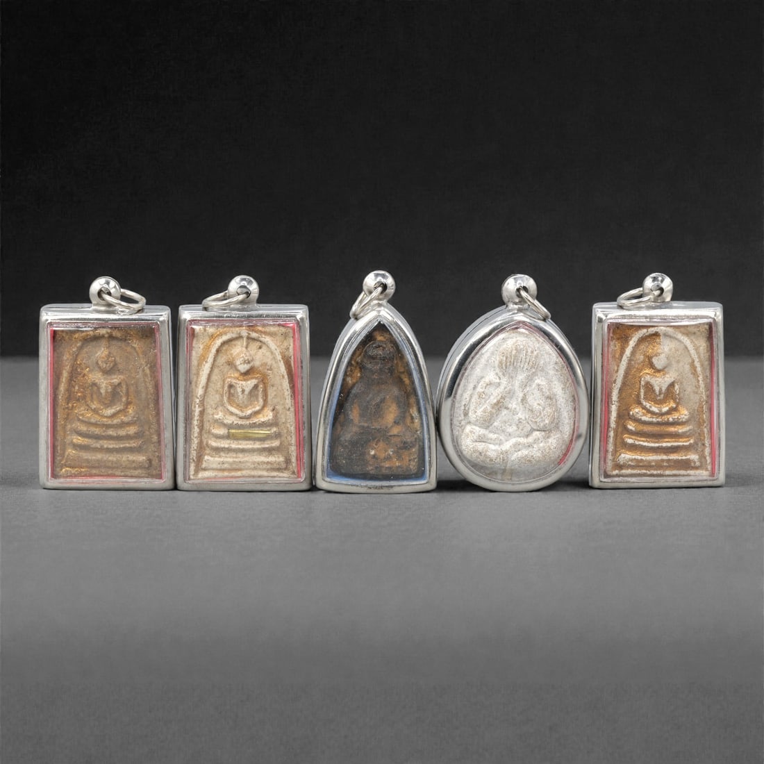 A Group of Thai Clay and Composite Buddhist Amulets, 20th Century, 12ZG (1 of 2)