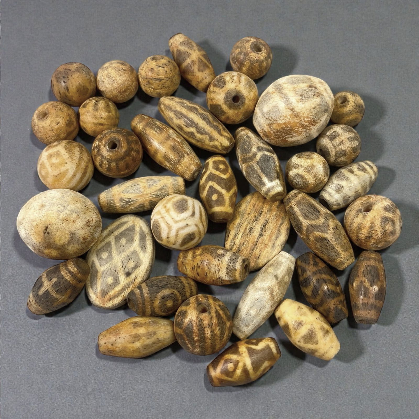 A Group of Asian Wooden and Pumtek Beads, 18th-19th Century, 21W (1 of 1)