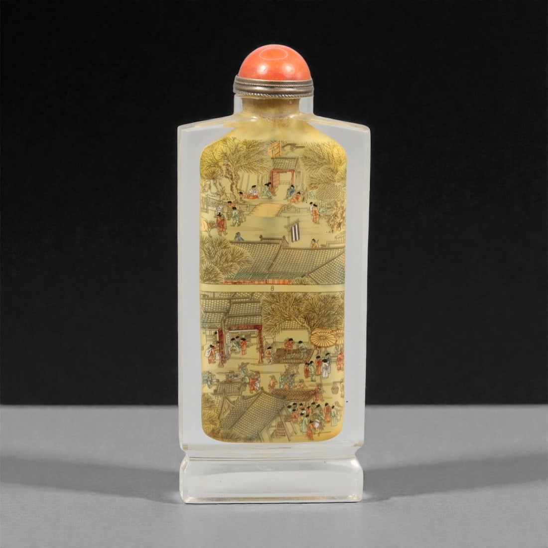 A Chinese Crystal Glass Snuff Bottle, 20th Century, 9YC: Formed from clear crystal glass with a flat rectangular body and chamfered edges, the bottle stands on a stepped rectangular foot and rises to a short cylindrical neck. The interior is painted with a
