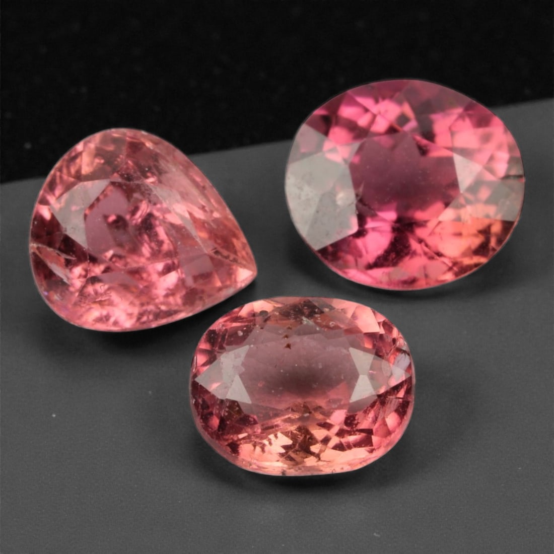 4.03 Carats Rose-Pink Garnet Selection - Natural Tanzanian - 7x7x4mm, 45XK: This charming trio of rose-pink garnets displays a delicate yet vivid palette, ranging from peach-blush to berry-toned pink. With mixed oval and pear silhouettes, each stone radiates with internal spa